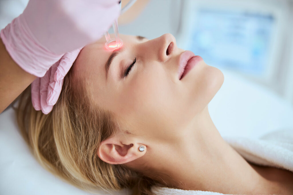 Anti aging cosmetology and beauty treatment product, woman using laser device for skin resurfacing as rejuvenation procedure and skincare routine | Coral Springs Med Spa in Coral Springs, FL